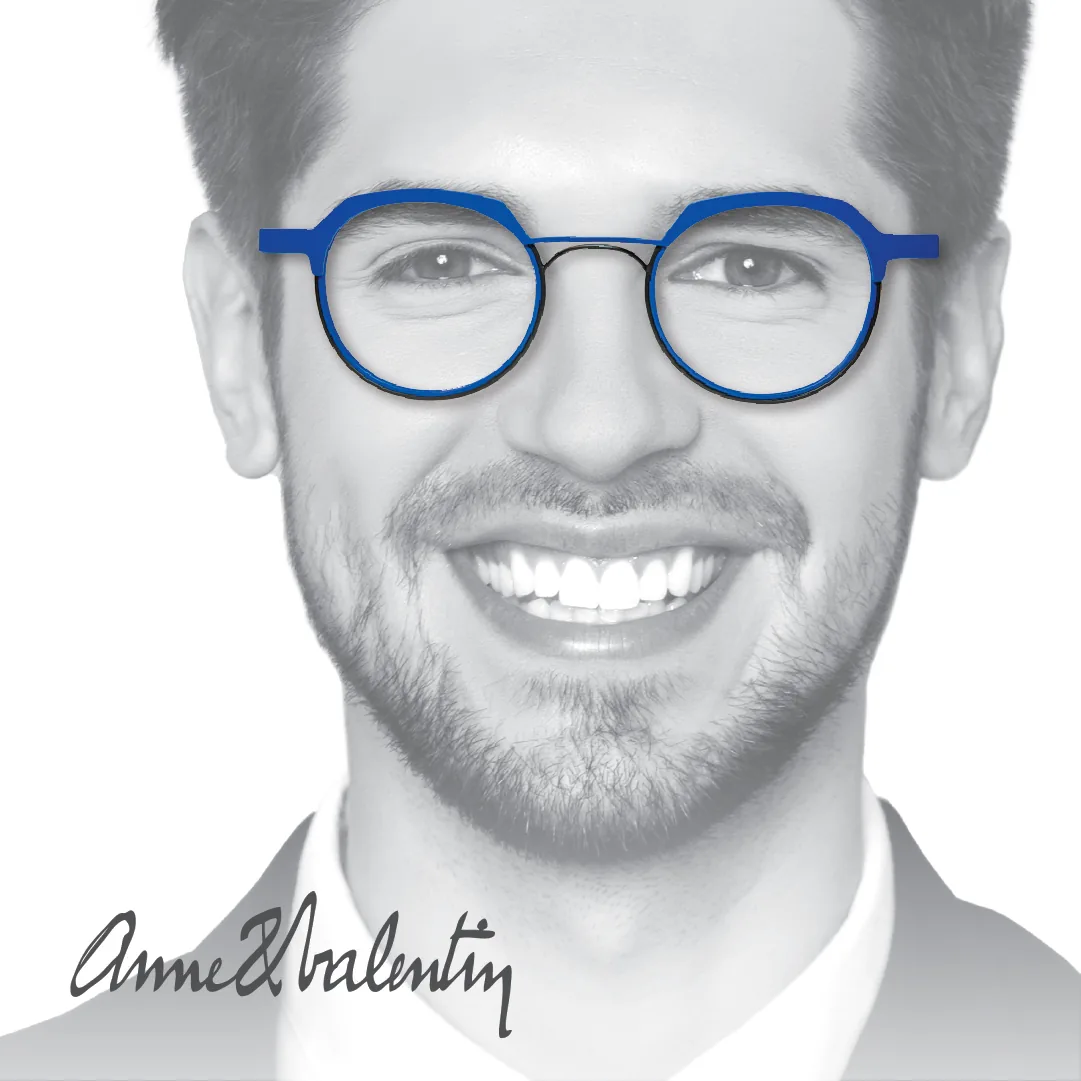 Round eyeglasses frame with blue brow line and black rims by Anne et Valentin